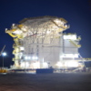 Under-construction living quarters lit up at night