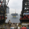 Living quarters (left, behind crane) being positioned